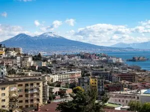 A view of a city with a mountain in the background