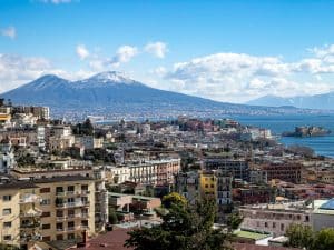 A view of a city with a mountain in the background